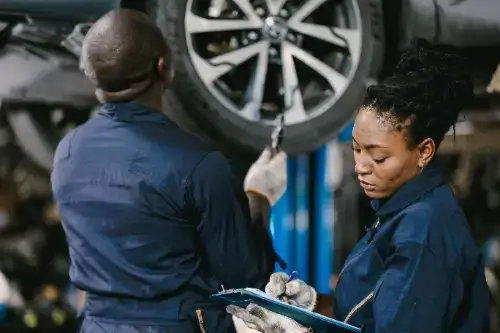 Mechanic team working on car repair
